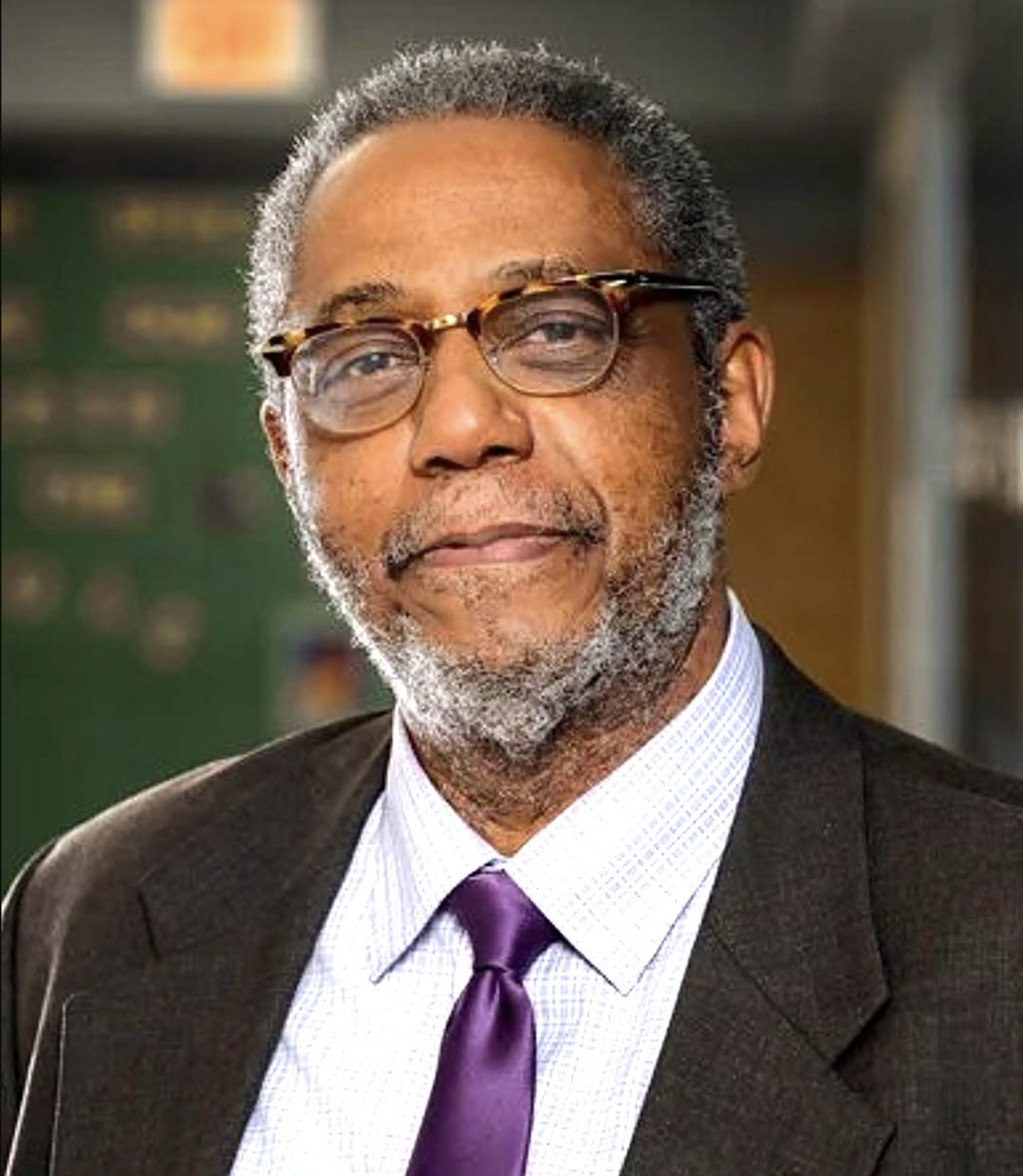 Henry Darby working at Walmart to support his students