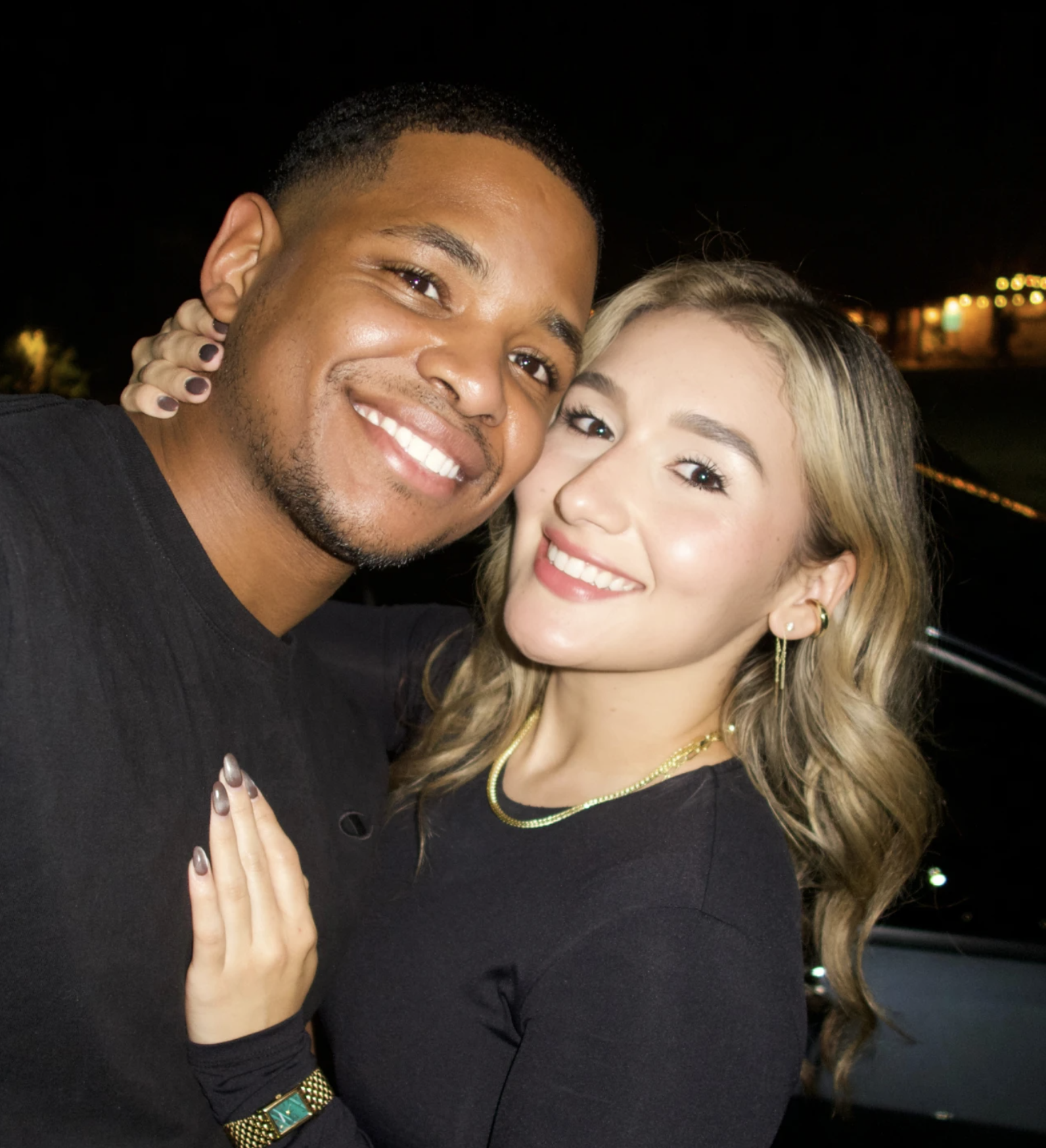 Stephanie Kenny-Velasquez and her husband Christopher Busby, an Army reservist and Black Hawk pilot, smiling together.