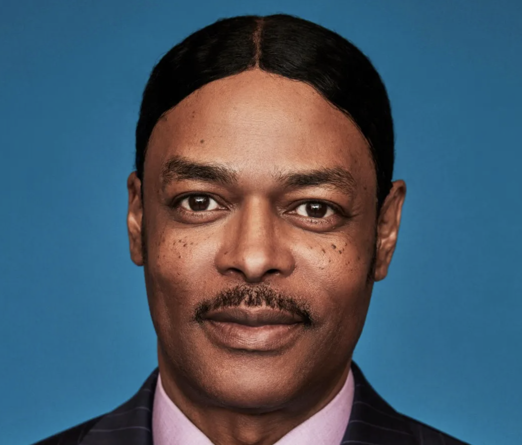 Isaac Wright Jr. standing confidently in a courtroom setting.