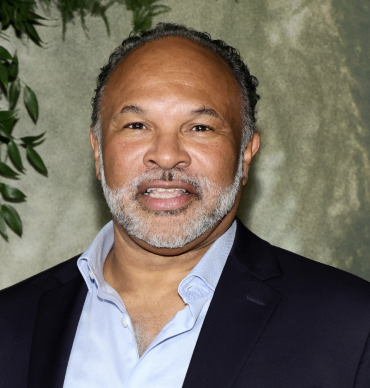 Geoffrey Owens smiling and looking towards the camera.