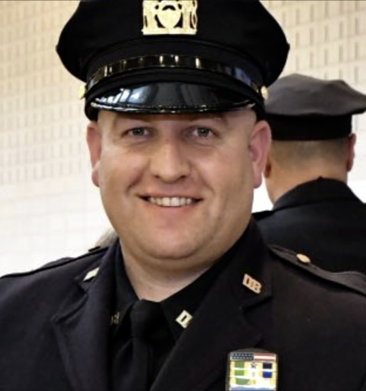 Detective Michael Greaney assisting a choking baby on the Bronx River Parkway