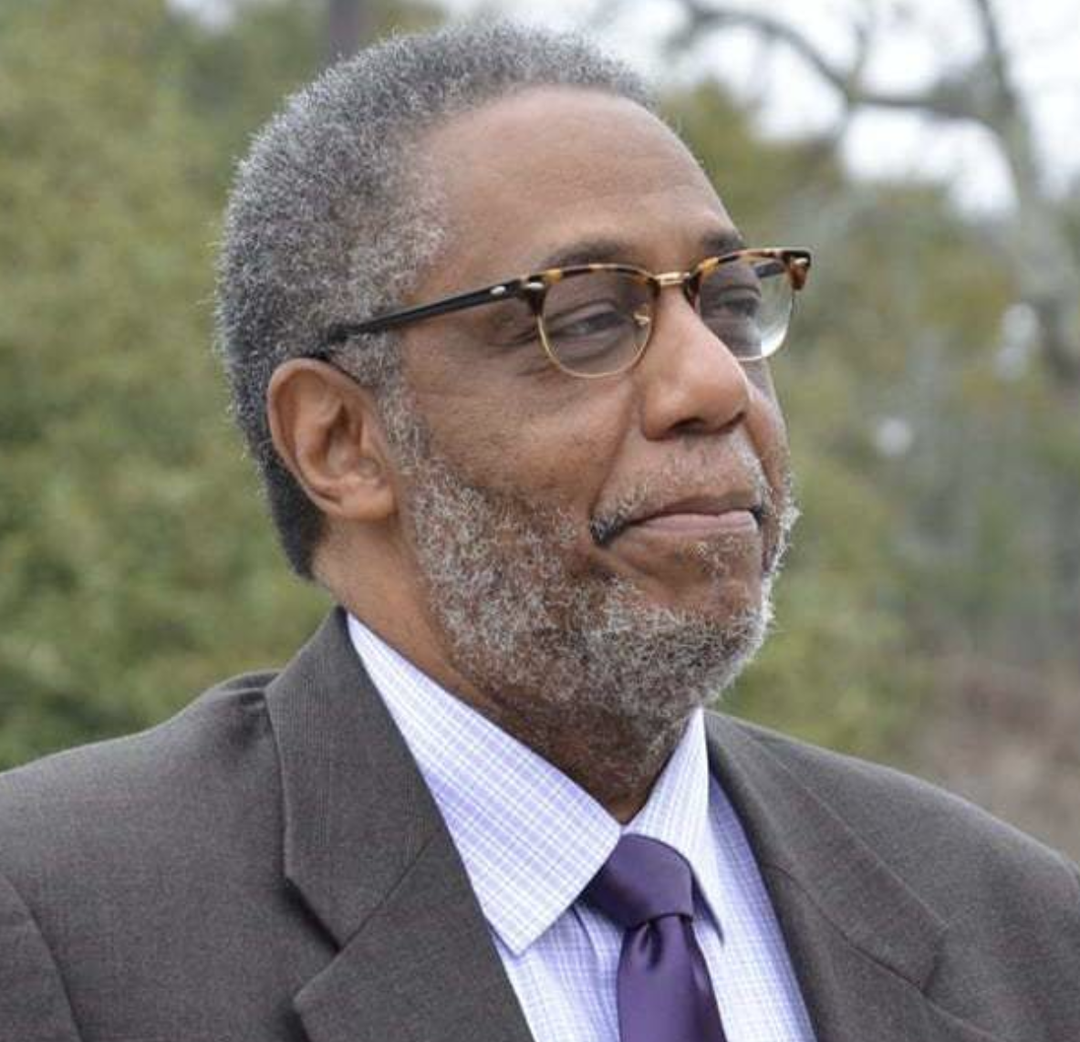 Henry Darby working at Walmart to support his students