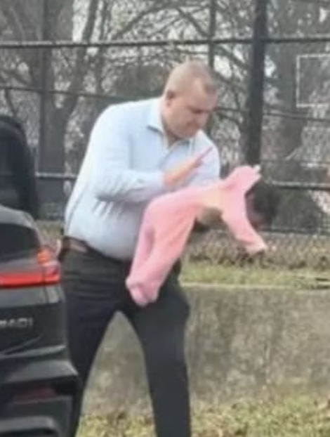 Detective Michael Greaney assisting a choking baby on the Bronx River Parkway